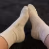 Weiße schwitzige Tennissocken